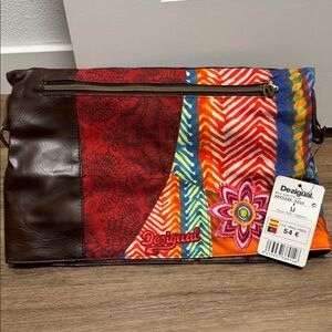 Desigual multi-color fold-over clutch crossbody bag.